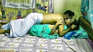Amateur couple on a living room sofa in explicit scene