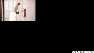 Couple mid-scene in a dim bedroom