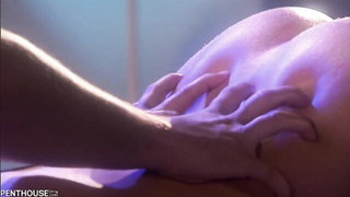 Couple mid-scene in a dim bedroom