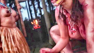 Explicit massage scene in a softly lit room