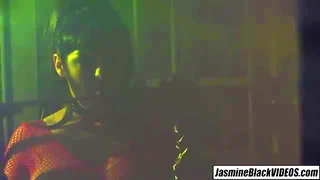 Couple mid-scene in a dim bedroom