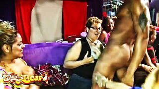 Couple mid-scene in a dim bedroom