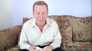 Couple mid-scene in a dim bedroom