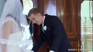 Couple mid-scene in a dim bedroom