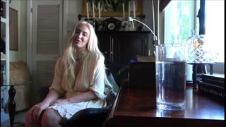 Couple mid-scene in a dim bedroom