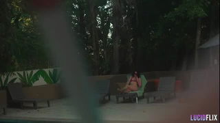 Couple mid-scene in a dim bedroom