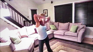 Amateur couple on a living room sofa in explicit scene
