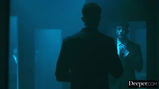 Couple mid-scene in a dim bedroom