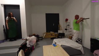 Explicit massage scene in a softly lit room