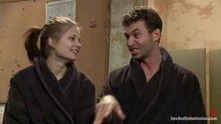 Couple mid-scene in a dim bedroom