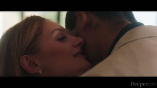 Couple mid-scene in a dim bedroom