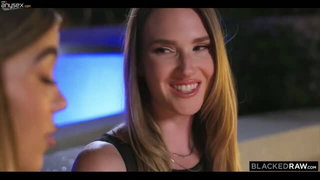 Couple on a patterned bedspread in an explicit scene