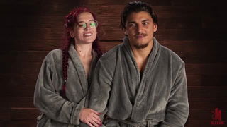 Explicit massage scene in a softly lit room