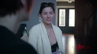 Explicit massage scene in a softly lit room
