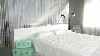 Couple on a made bed in an explicit scene