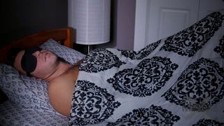 Pair of performers in motion on a wide bed