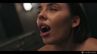Explicit massage scene in a softly lit room