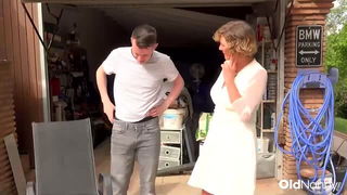 Couple mid-scene in a dim bedroom