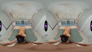 Couple mid-scene in a dim bedroom