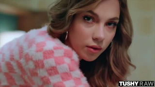 Studio set with performers in an explicit scene under bright lights