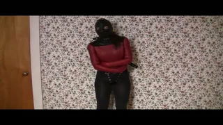 Solo performer with a toy on rumpled bedsheets